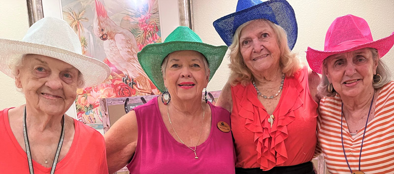 assisted living Aravilla Sarasota residents with cowboy hats
