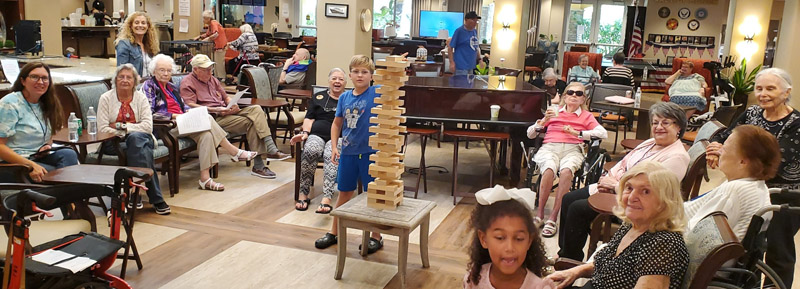 assisted living residents Aravilla Sarasota playing jenga