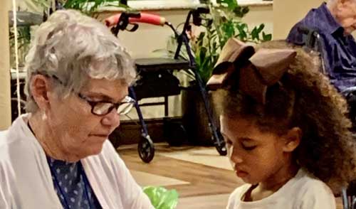 assisted living resident crocheting