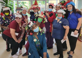 The Aravilla Staff with their ugly Christmas hats.