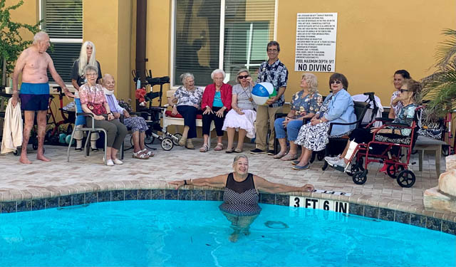 senior residents at Aravilla Sarasota enjoying water aeorobics