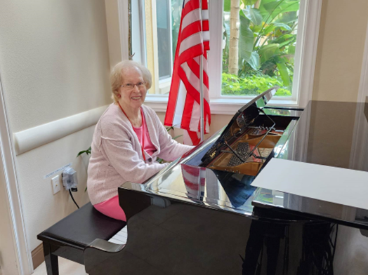 memory care resident playing piano